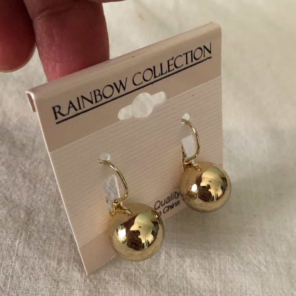 Rainbow Collection ball drop earrings feature a polished gold-colored finish on